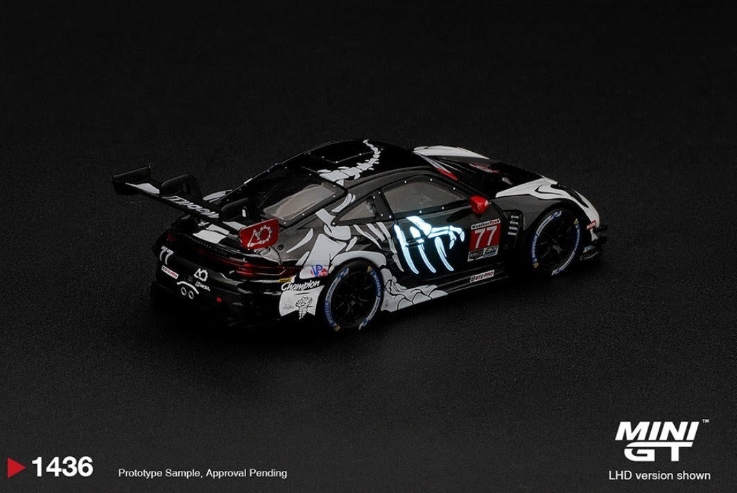PREORDER: Mini GT x AO Racing Porsche 911 GT3 R (992) #77 "Skeleton Rexy / Skelly" - 2026 IMSA Petit Le Mans - Glow-in-the-Dark