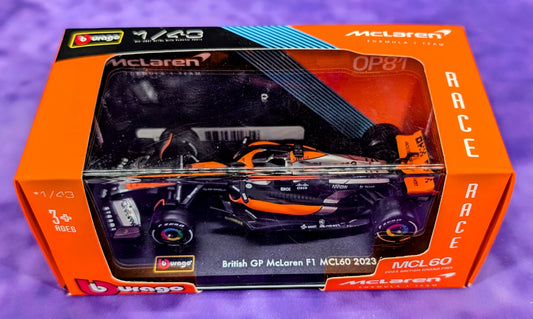 Bburago 1/43 McLaren MCL60 F1 2023 British Grand Prix - Lando Norris and Oscar Piastri - Premium in an Acrylic Case